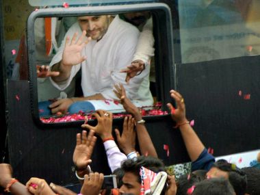 Congress vice-president Rahul Gandhi waves at supporters during a road show as part of his Kisan Yatra in Deoria on Tuesday. PTI