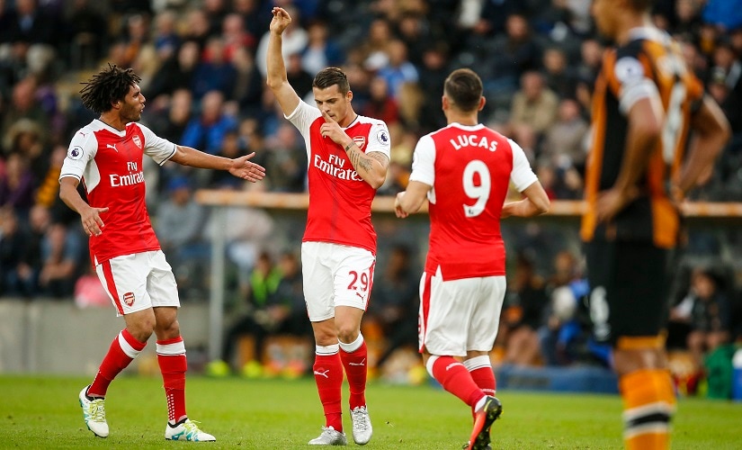 Arsenal's Mohamed Elneny (left) Granit Xhaka (centre) and Lucas Perez (right) will look to pick up some valuable minutes in Tuesday night's EFL Cup match. AP
