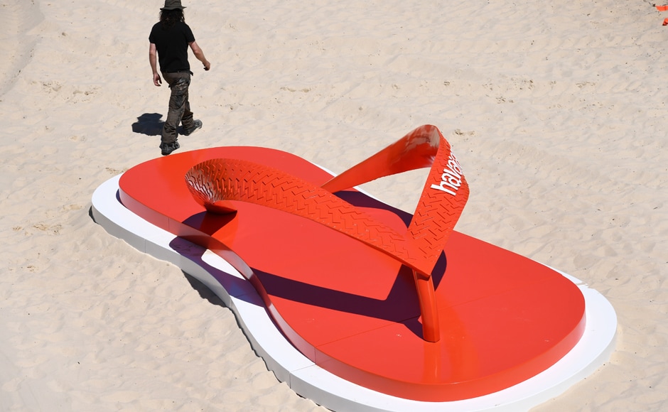 The event celebrated its 20th anniversary this year. A man walks past a giant jandal on Tamarama Beach. Photo: AFP The event celebrated its 20th anniversary this year. A man walks past a giant jandal on Tamarama Beach. Photo: AFP