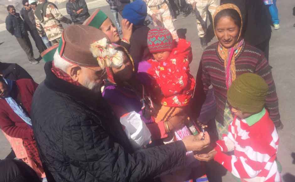 Villagers taken aback by the Prime Minister's arrival raised slogans hailing him. Dressed in warm clothes, Modi spent time with the residents of the village including women and children. (Photo: Twitter@ narendramodi) Villagers taken aback by the Prime Minister's arrival raised slogans hailing him. Dressed in warm clothes, Modi spent time with the residents of the village including women and children. (Photo: Twitter@ narendramodi)