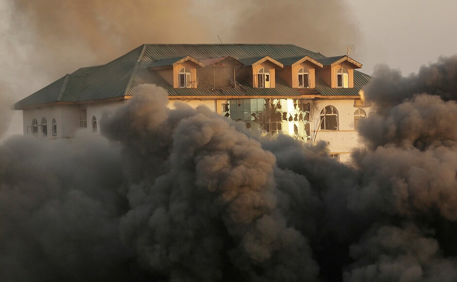 Smoke and dust engulfed the building of Jammu and Kashmir Entrepreneurship Development Institute (JKEDI) where suspected militants have taken refuge. Photo: AP Smoke and dust engulfed the building of Jammu and Kashmir Entrepreneurship Development Institute (JKEDI) where suspected militants have taken refuge. Photo: AP