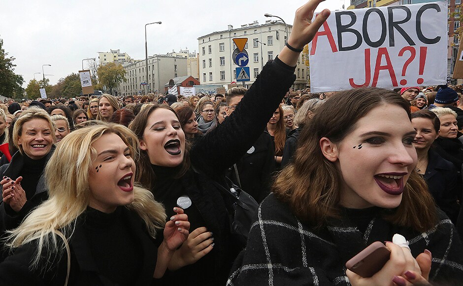 In Brussels, some 200 black-clad protesters joined the campaign, picketing in front of the European Union offices on behalf of Polish women, with banners reading In Brussels, some 200 black-clad protesters joined the campaign, picketing in front of the European Union offices on behalf of Polish women, with banners reading