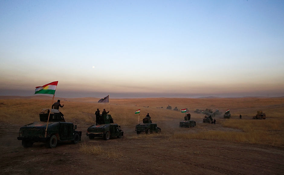 Convoys of Iraqi, Kurdish and US forces moved east of Mosul along the front line as US-led coalition airstrikes sent plumes of smokes into the air and heavy artillery rounds could be heard. This Peshmerga convoy is headed towards a frontline in Khazer, about 30 kilometers (19 miles) east of Mosul, Iraq. AP Convoys of Iraqi, Kurdish and US forces moved east of Mosul along the front line as US-led coalition airstrikes sent plumes of smokes into the air and heavy artillery rounds could be heard. This Peshmerga convoy is headed towards a frontline in Khazer, about 30 kilometers (19 miles) east of Mosul, Iraq. AP