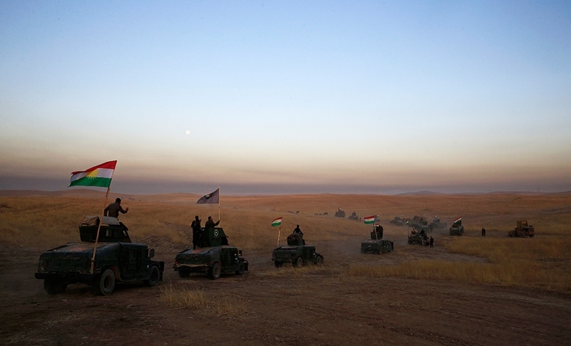 Convoys of Iraqi, Kurdish and US forces moved east of Mosul along the front line as US-led coalition airstrikes sent plumes of smokes into the air and heavy artillery rounds could be heard. This Peshmerga convoy is headed towards a frontline in Khazer, about 30 kilometers (19 miles) east of Mosul, Iraq. AP