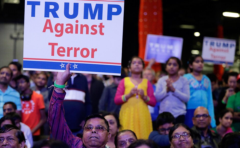 Supporters of Trump hold up signs. Trump gave India BFF status and praised Narendra Modi. AP Supporters of Trump hold up signs. Trump gave India BFF status and praised Narendra Modi. AP