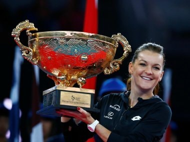 Agnieszka Radwanska holds the China Open trophy after defeating Johanna Konta. Reuters
