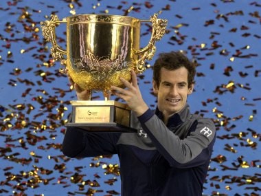 Andy Murray poses with the china Open trophy after defeating Grigor Dimitrov. AP
