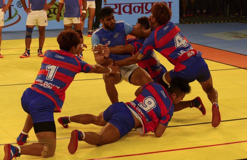 South Korean kabaddi players pounce on an Indian opponent during the 2016 Kabaddi World Cup in Ahmedabad. AFP