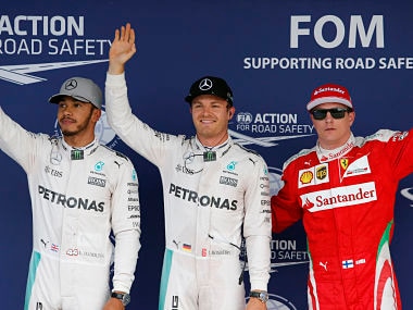 Nico Rosberg,waves with teammate Lewis Hamilton Britain and Kimi Raikkonen of Finland after taking pole for the Japanese Formula One Grand Prix. AP