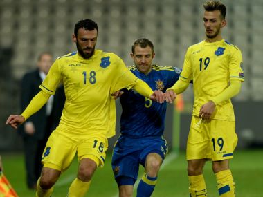 Kosovo players vie for the ball against Ukraine. AFP