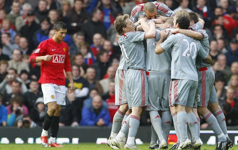 Liverpool players celebrate after Fabio Aurelio scores against Manchester United. Reuters