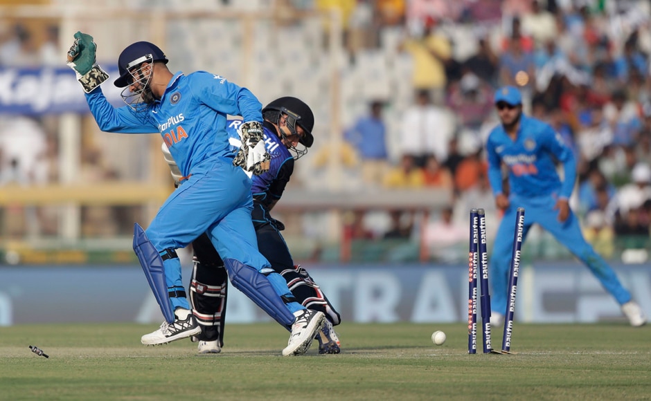 Quick hands! Captain MS Dhoni nicked the bails of Ross Taylor at first and then proceeded to get Luke Ronchi's number as well. AP Quick hands! Captain MS Dhoni nicked the bails of Ross Taylor at first and then proceeded to get Luke Ronchi's number as well. AP