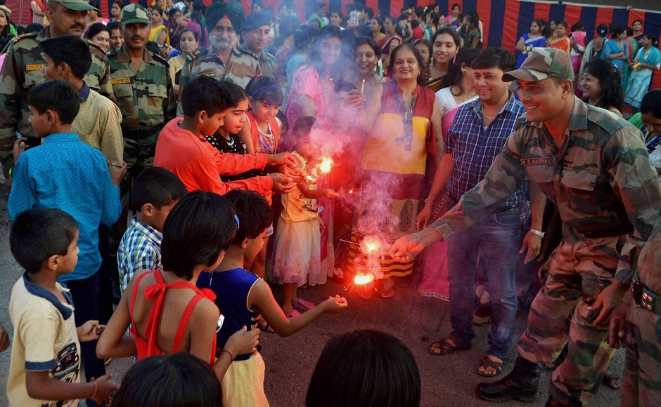Children celebrated Diwali with soldiers at Army Cantonment area near Beawar, Rajasthan. (Photo: PTI) Children celebrated Diwali with soldiers at Army Cantonment area near Beawar, Rajasthan. (Photo: PTI)