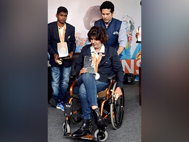Cricketer Sachin Tendulkar with paralympic silver medalist Deepa Malik and gold medalist Mariyappan Thangavelu during a felecitation ceremony. PTI
