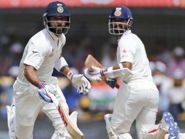 Indian cricket captain Virat Kohli runs between the wicket with Ajinkya Rahane. AP