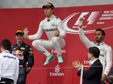Mercedes driver Nico Rosberg celebrates on the podium after winning the Japanese GP. AP