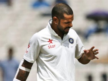 Shikhar Dhawan after getting hit at Eden Gardens. AP