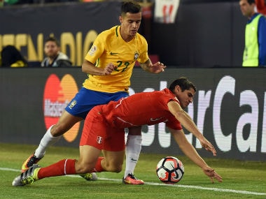 File photo of Brazil's Philippe Coutinho (L). AFP