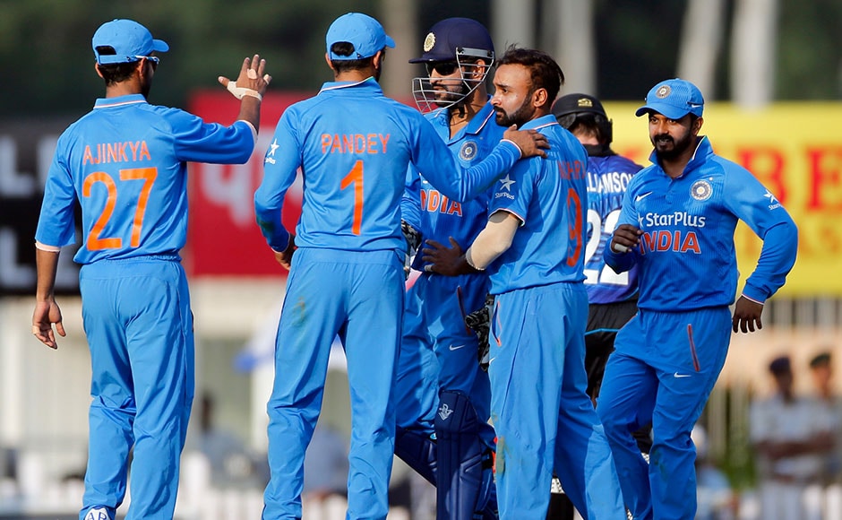 India's Mahendra Singh Dhoni and Amit Mishra celebrates after New Zealand's Kane Williamson's wicket during the forth one-day international cricket match against New Zealand in Ranchi, India, Wednesday, Oct. 26, 2016. (AP Photo/Rajanish Kakade)