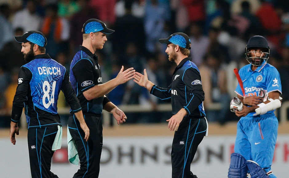 New Zealand's James Neesham , left and Kane Williamson celebrates after won the forth one-day international cricket match against India in Ranchi, India, Wednesday, Oct. 26, 2016. (AP Photo/Rajanish Kakade)