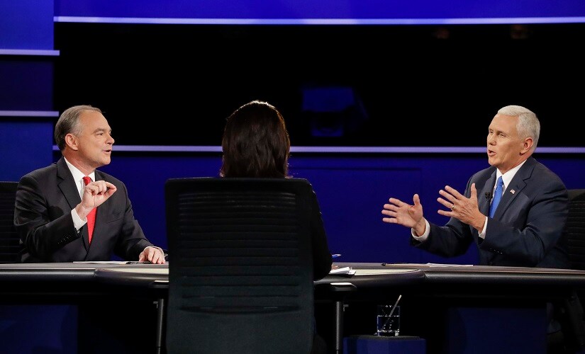 Republican vice-presidential nominees Tim Kaine and Mike Pence at the debate. AP