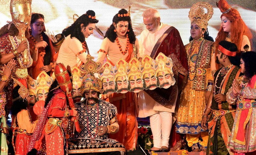 Prime Minister Narendra Modi interacts with the artists during Dussehra celebrations at Aishbagh Ram Leela in Lucknow, Uttar Pradesh on Tuesday. PTI