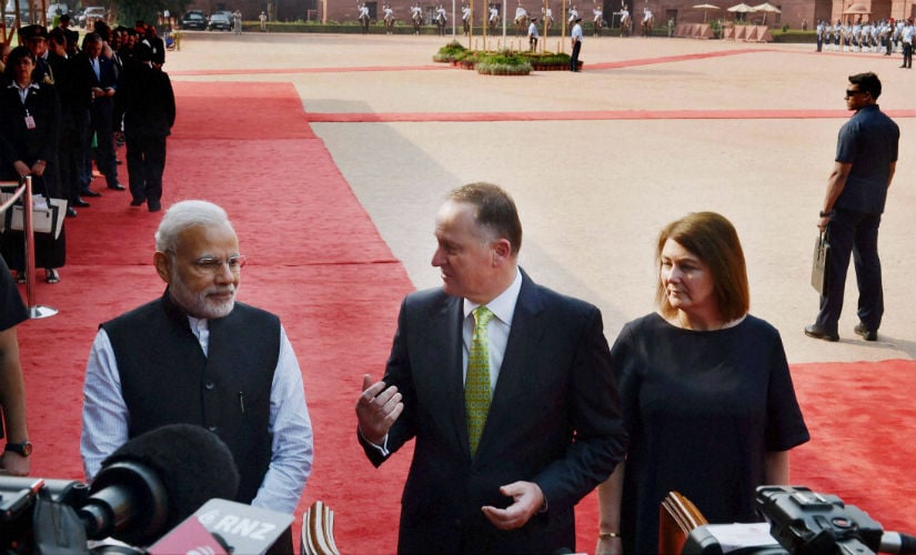 PM Modi greets PM John Key in India. PTI