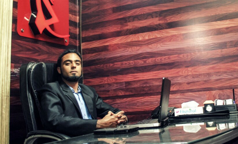 Haris Ahmad Dullo, who runs an Advertising company, City Sign Technology, in Srinagar. Image courtesy: Sameer Yasir