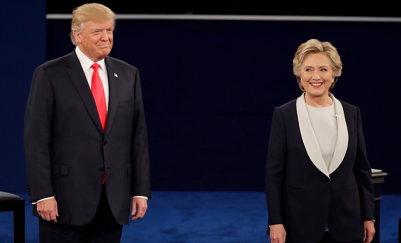 Republican presidential nominee Donald Trump stands next to Democratic presidential nominee Hillary Clinton during the second presidential debate at Washington University in St Louis. AP