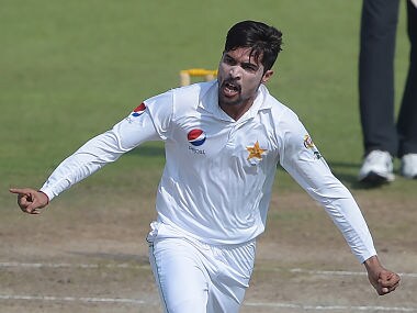 Pakistani bowler Mohammad Amir celebrates after taking the wicket of West Indies' cricket captain Jason Holder. AFP