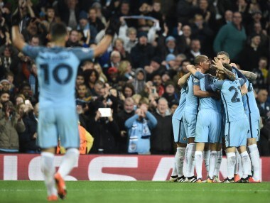 Manchester City players celebrate as Ilkay Gundogan scores his team's third goal against Barcelona. AFP