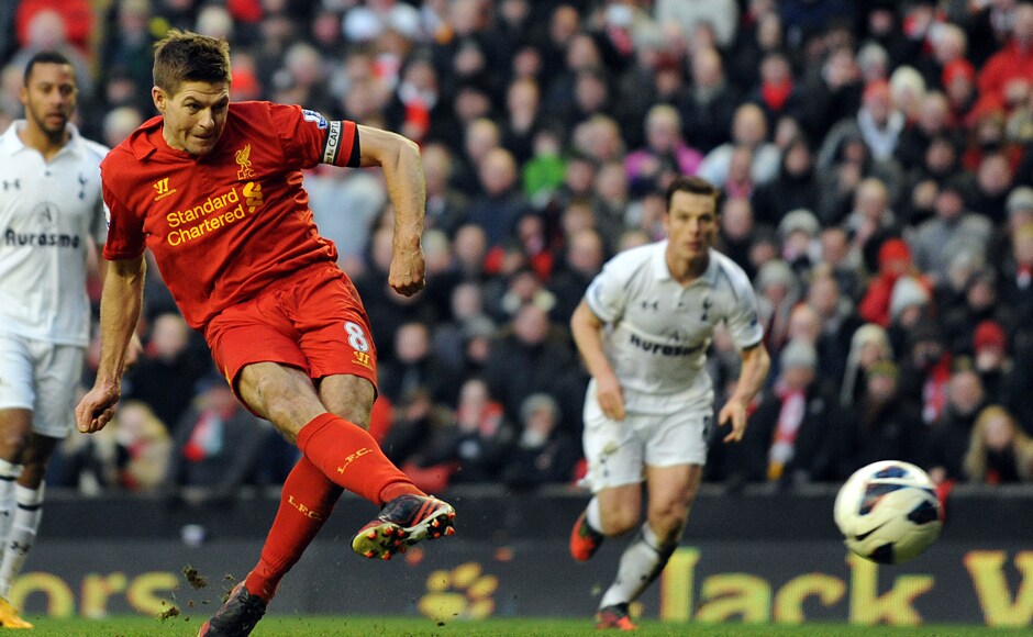 In this Sunday March 10, 2013 file photo, Liverpool's Steven Gerrard scores the third and winning goal of the game for his side from the penalty spot during their English Premier League soccer match against Tottenham Hotspur at Anfield, Liverpool. Gerrard, the former Liverpool and England captain, announced his retirement from professional soccer on Thursday, Nov. 24, 2016 and said he is considering a "number of options" about his next career move. (AP Photo/Clint Hughes, File)