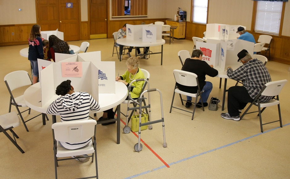 Voters fill out their ballots at a polling station at the Princeton Baptist Church in Princeton, North Carolina. Reuters Voters fill out their ballots at a polling station at the Princeton Baptist Church in Princeton, North Carolina. Reuters