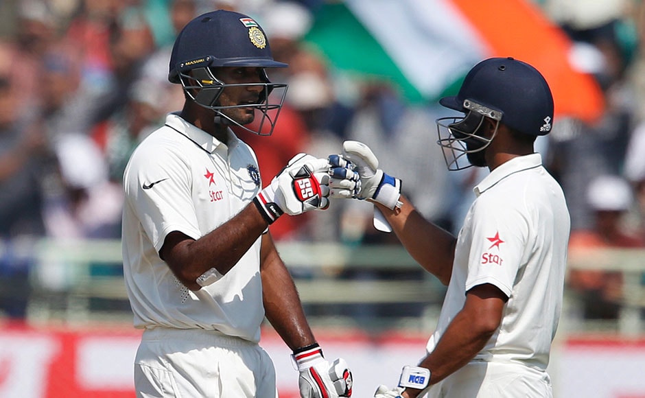 India's Jayant Yadav, left, and Mohammed Shami greet each other during the fourth day of their second cricket test match against England in Visakhapatnam, India, Sunday, Nov. 20, 2016. (AP Photo/Aijaz Rahi)