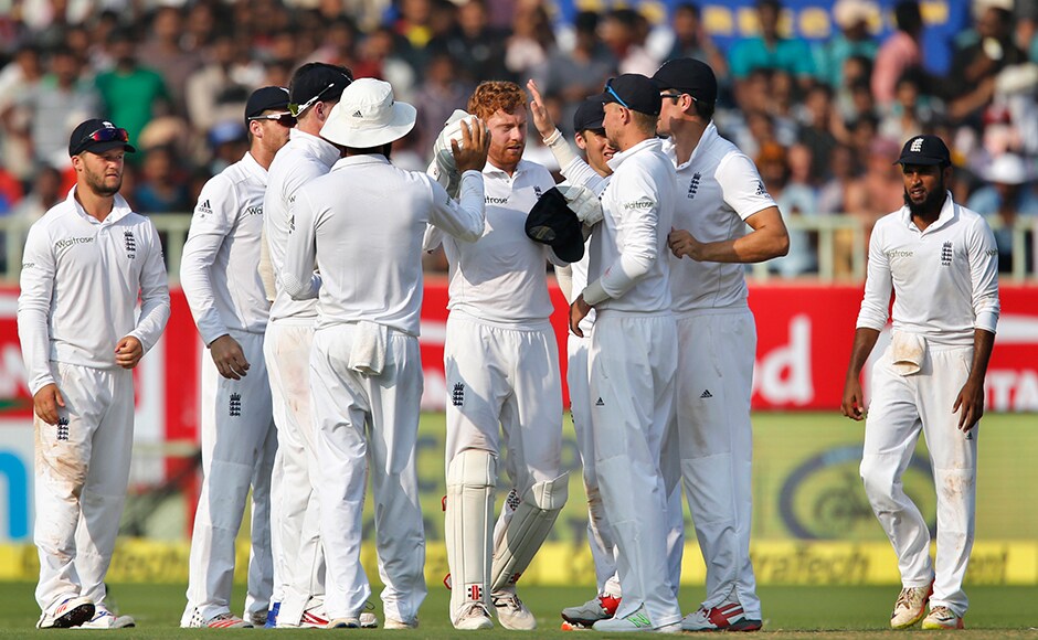 England's Jonny Bairstow, center, celebrates with teammates the dismissal of India's Cheteshwar Pujara on the first day of their second cricket test match in Visakhapatnam, India, Thursday, Nov. 17, 2016. (AP Photo/Aijaz Rahi)