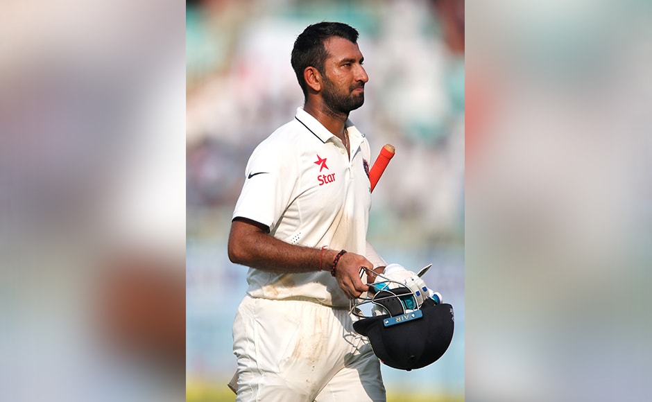 India's Cheteshwar Pujara leaves the ground after losing his wicket on the first day of their second cricket test match against England in Visakhapatnam, India, Thursday, Nov. 17, 2016. (AP Photo/Aijaz Rahi)