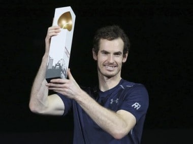 Andy Murray holds the trophy after winning the final match against Jo-Wilfried Tsonga. AP