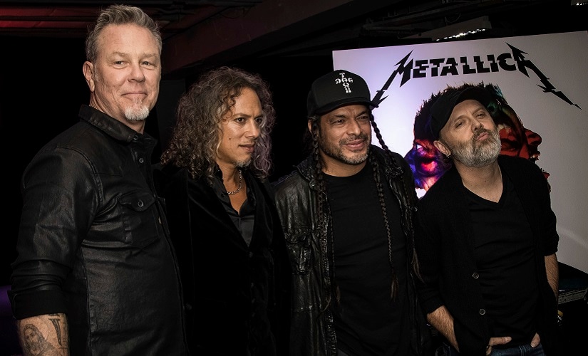 Metallica, (from left) James Hetfield, Kirk Hammett, Robert Trujillo and Lars Ulrich pose for photographers during a photo call before signing copies of the new album in London. AP