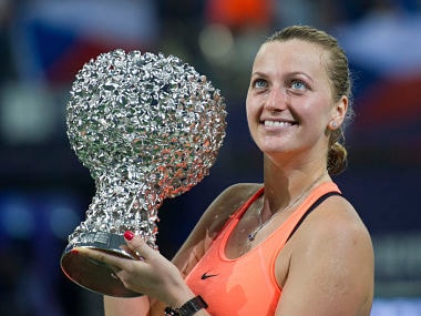 Petra Kvitova of the Czech Republic poses with her winners trophy after defeating Elina Svitolina of Ukraine in the WTA Elite Trophy tournament. AP