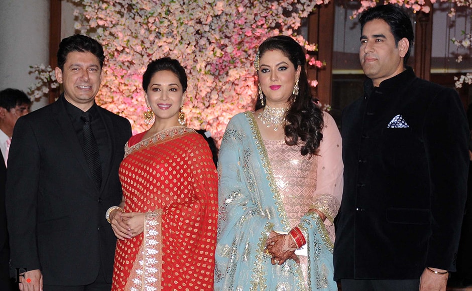 Madhuri Dixit and her husband pose with the bride Shaina Rakesh Nath and groom Gautam. Sachin Gokhale/Firstpost Madhuri Dixit and her husband pose with the bride Shaina Rakesh Nath and groom Gautam. Sachin Gokhale/Firstpost