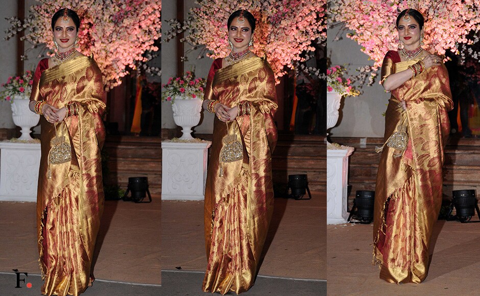 Rekha wore a gorgeous golden saree with a crimson print. Sachin Gokhale/Firstpost Rekha wore a gorgeous golden saree with a crimson print. Sachin Gokhale/Firstpost