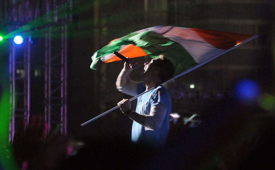 Chris Martin performs with the Indian flag at the Global Citizen Festival India. Sachin Gokhale/Firstpost Chris Martin performs with the Indian flag at the Global Citizen Festival India. Sachin Gokhale/Firstpost