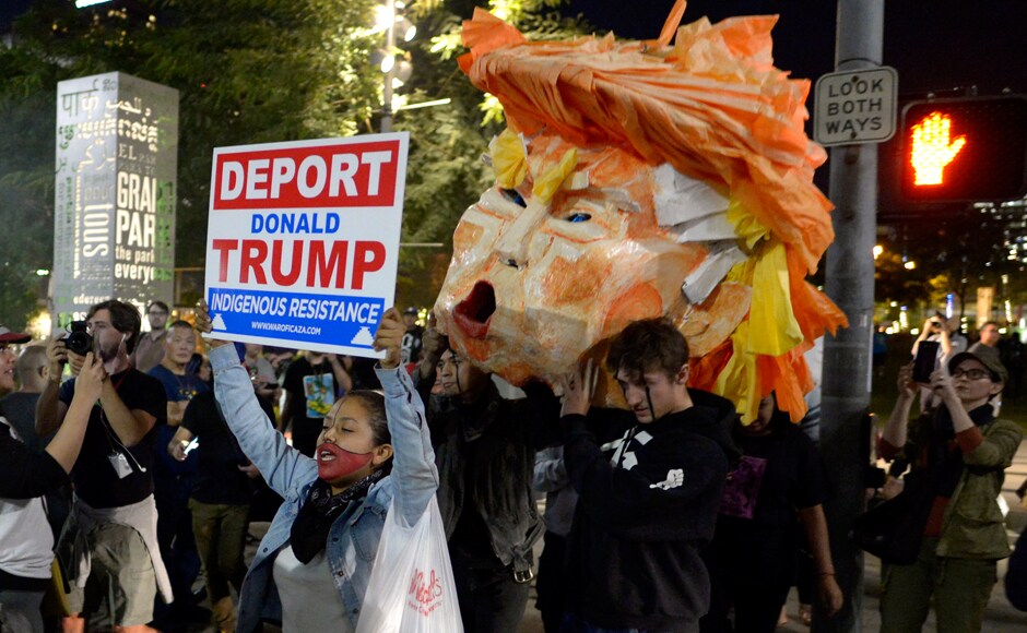 And held signs that read And held signs that read
