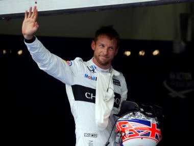 McLaren's Jenson Button of Britain waves to his fans. Reuters