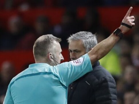 Manchester United Manager Jose Mourinho checks his watch 