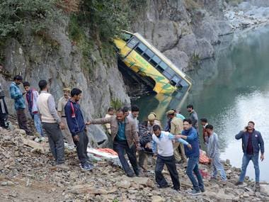 Rescue operation in progress after a bus fell into Beas river on Delhi-Manali national highway near Mandi on Saturday. PTI