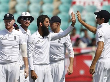 Moeen Ali celebrates with teammates the dismissal of Ravindra Jadeja on Day 2. AP