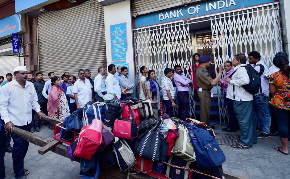 Long queues were witnessed at banks and ATMs, which opened after two days, as people rushed to get new banknotes in lieu of their old defunct bills. PTI Long queues were witnessed at banks and ATMs, which opened after two days, as people rushed to get new banknotes in lieu of their old defunct bills. PTI