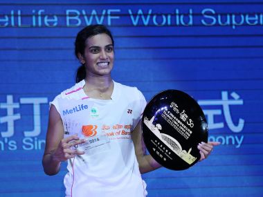 PV Sindhu celebrates with her trophy after winning the China Open. AFP