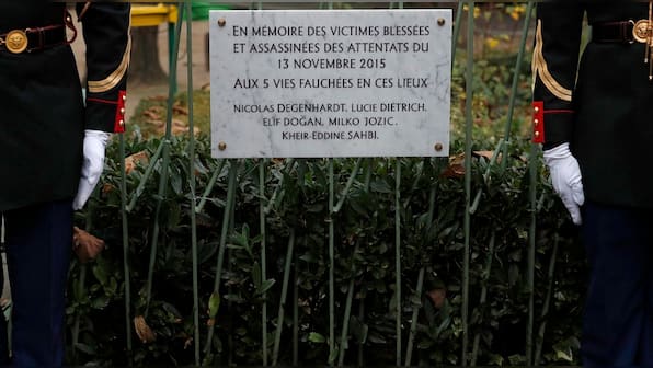 A year on, France remembers 130 killed in Paris attacks; Sting reopens Bataclan concert hall